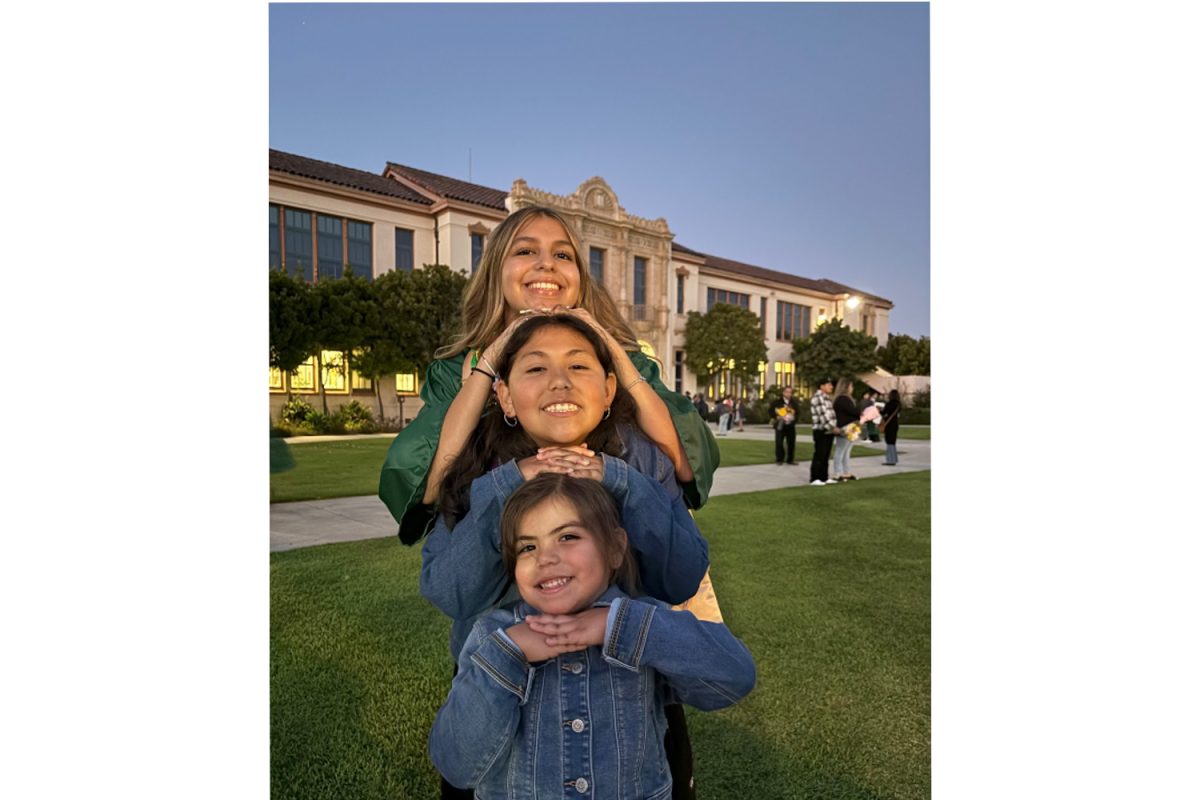 Ruiz and her two sisters smiling after Ruiz graduated Santa Barbara High School in Summer 2024. Ruiz is happy to be an older sister.